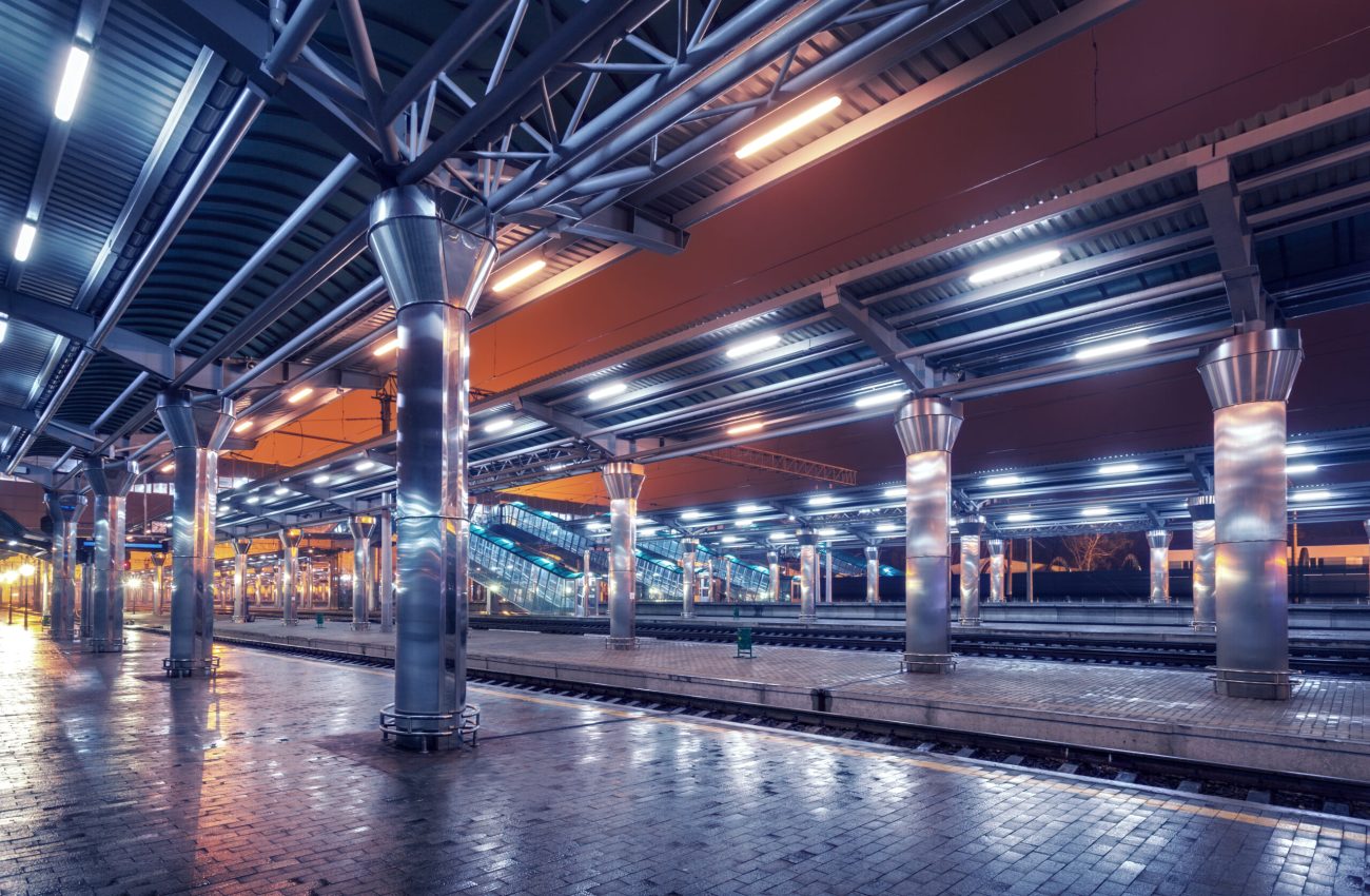 Railway station at night. Train platform in fog. Railroad in Donetsk
