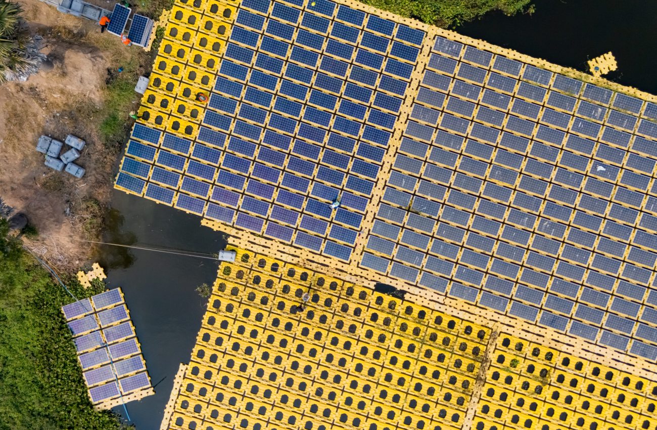 Floating solar photovoltaic panels at sustainable electrical power plant for generating clean electric energy. Concept of renewable electricity with zero emission on water surface.